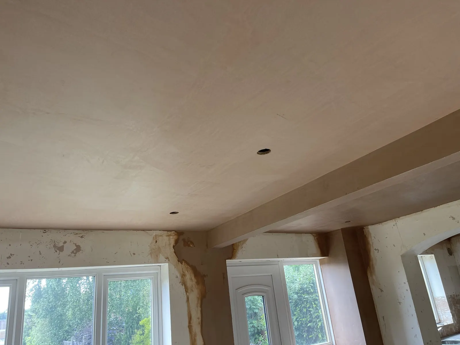 The same ceiling after plastering: smooth, flat and ready to decorate.