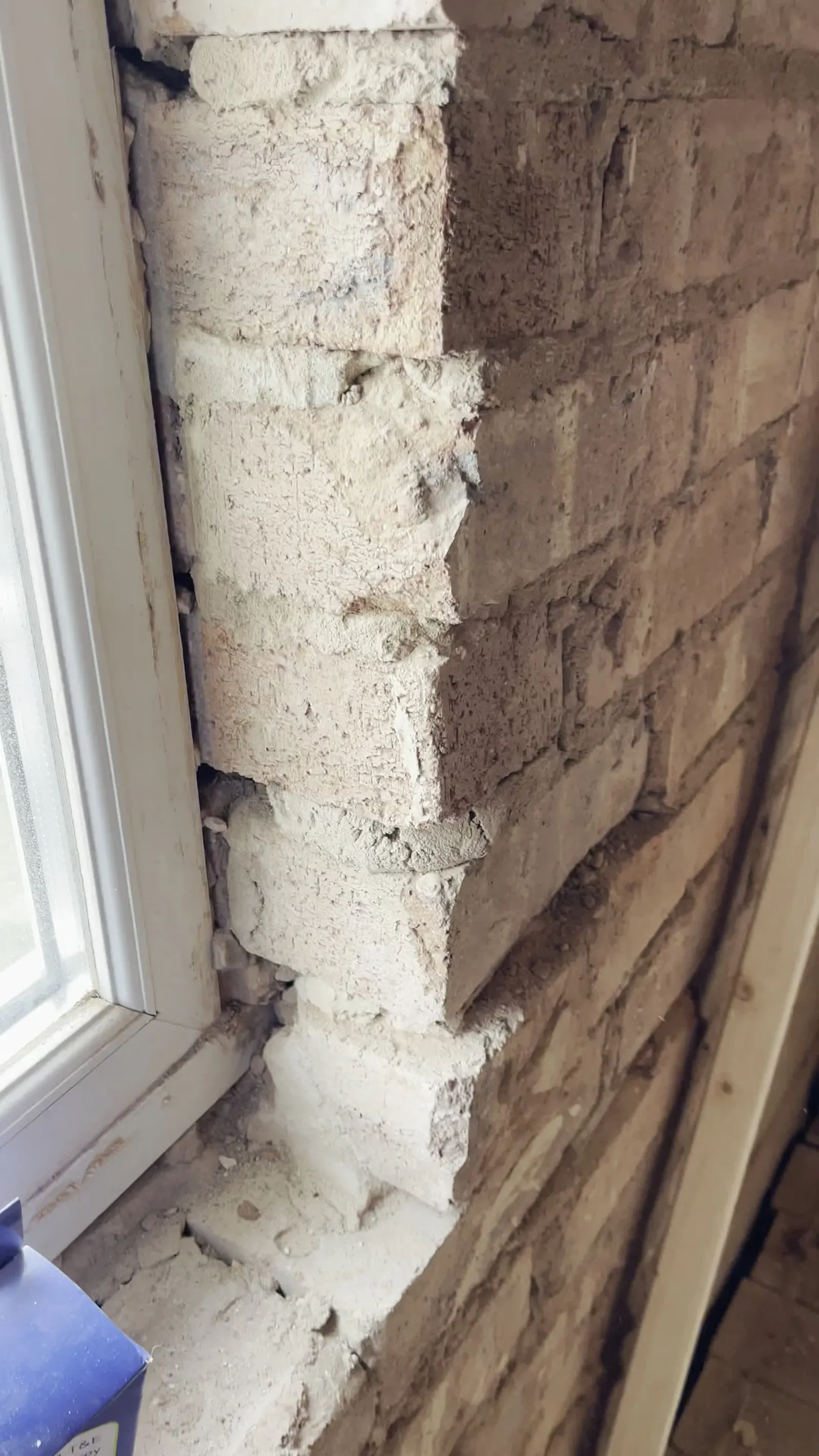 Checking the window reveals and the wall behind before designing the insulation.